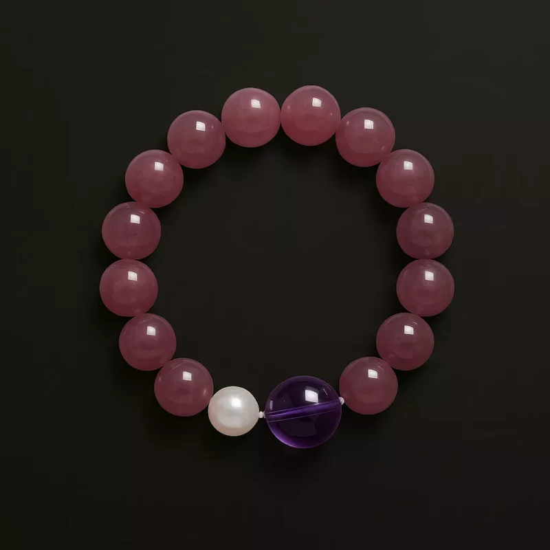 A pink strawberry quartz bracelet made with 10mm round beads, designed to attract love and amplify charisma. The bracelet is infused with Taoist energy and features a soft glow that symbolizes emotional balance and romantic energy.